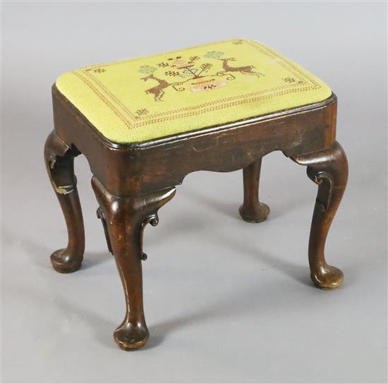 An early 18th century red walnut stool, W.1ft 6in. D.1ft 2in. H.1ft 4in.